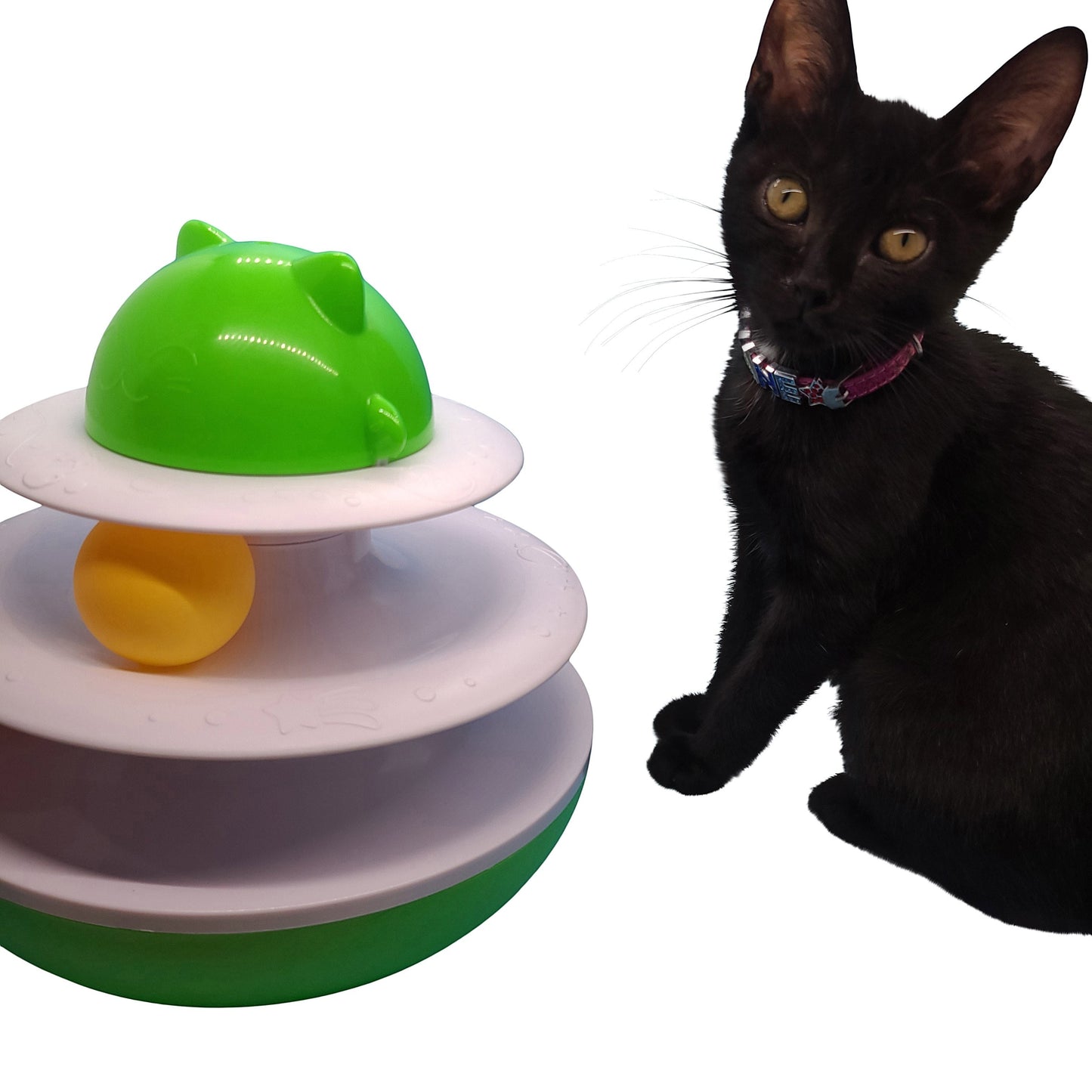 Albert Catstein turntable cat toy with green mouse top, yellow ball, and white tiers. A black kitten sits beside it.